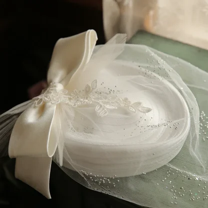 Bridal White Clip-on Fascinator with Bow Design - Image 2